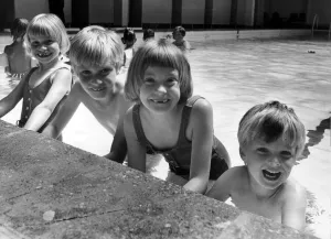 Medical Prints: The three surviving Thorns sextuplets with their younger brother David at the swimming
