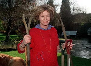Susannah York actress in garden Feb 90 holding garden tools A©Mirrorpix