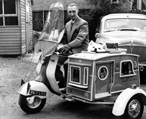 Scooter Prints: Susie the Samoyed dog drives off on the motor scooter with her owner Mr Charles Tumbridge