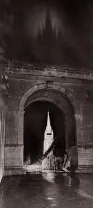 Through the suspension bridge arch under which two girls shelter All Saints Church