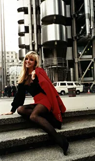 Skirt Prints: Suzanne Mizzi Model sitting on steps outside the Lloyds building