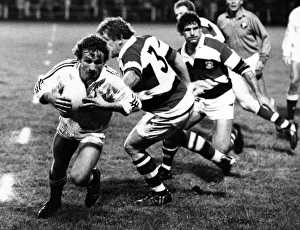 Swansea scrum half Alan Williams gets away from Pontypools Graham Price. Circa 1989