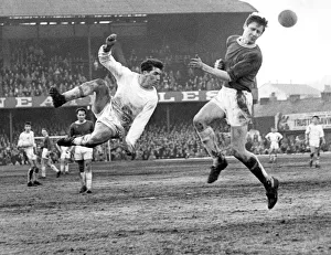 Acrobatic Prints: Swansea Town player Brayley Reynolds takes a flying leap but is beaten by Queen