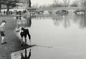 Flood Prints: The swollen River Avon at Stratford with the water level with the lawns at the Stratford