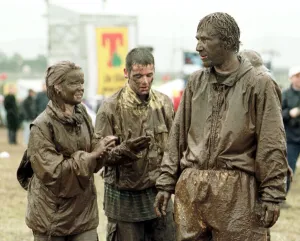Muddy Prints: T in the Park Concert in Balado, Scotland July 1998 Festival goers covered in mud