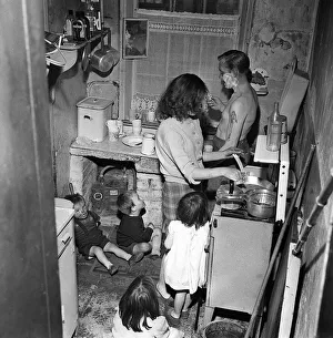 Taken from a set of pictures showing slum housing in post war Britain