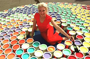 Paint Prints: Tamara Beckwith Socialite sits amongst paint pots July 1999 at a launch signalling