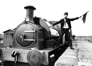 00339 Prints: Tanfield Railway Association guard Bob Payne flags away the newly-commissioned Hawthorn