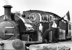00339 Prints: Tanfield Railway Association guard Bob Payne flags away the newly-commissioned Hawthorn
