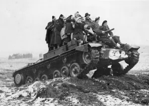 Warfare Prints: A tank carrying munition workers to mimic a battle arranged for the benefit of