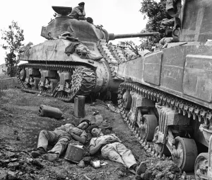 Bombing Prints: Tankmen of the Canadian Army rest by their Sherman tanks after the tank battle which took