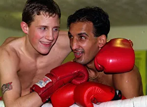 Tanveer Ahmed Glasgow lightweight Boxer with his arms round sparring partner Scott Dixon