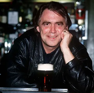 Bill Tarmey Actor Jack Duckworth of Coronation Street leaning on bar with pint of beer