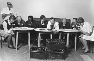Judges Prints: A tasting panel of men and women smell the aroma from glasses of Guiness at the Park