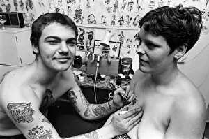 Tattoo Prints: Tattooist John Taylor, 16, from Kings Lynn tattooing Della Gilbert, 20. 1st July 1978