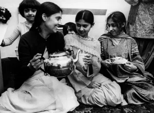 Serving Prints: Some tea and cakes in the English style are served to a group of Pakistani women