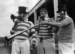 Team members of Manchester Rugby Union Club dressed up in fancy dress playing musical