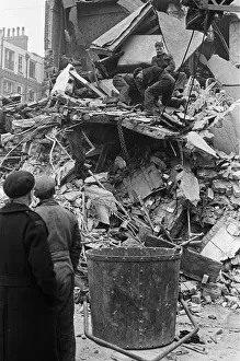01491 Prints: Teams from Heavy Rescue and the LCC (London County Council) seen searching