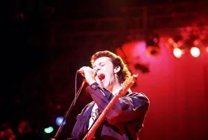 Tears For Fears Lead singer Roland Orzabal singing on stage