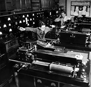 Technicians at work in the Telephoto room at the Daily Mirror Fetters Lane offices in
