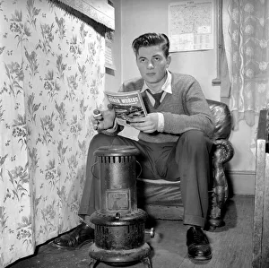 00068 Prints: Teenage author Thomas Folks seen here reading science fiction stories in his bedroom