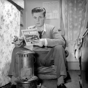 Teenage author Thomas Folks seen here reading science fiction stories in his bedroom