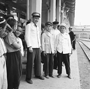 Rusia Prints: Teenage boys seen here waiting on the platform of an un-named town in central Russia