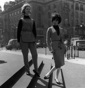 Teenage Fashion in the sixties Two young girls standing on steps in the street