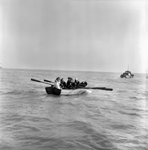 00034 Prints: Five teenage members of Armageddon'pop group rowing the channel today