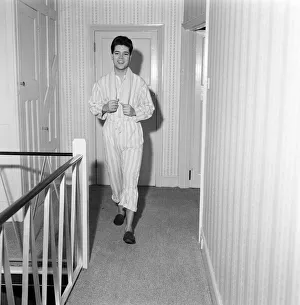 01169 Prints: Teenage pop idol Cliff Richard relaxes on his divan at his Winchmore Hill home