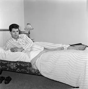 01169 Prints: Teenage pop idol Cliff Richard relaxes on his divan at his Winchmore Hill home