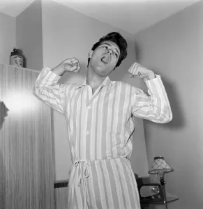 01169 Prints: Teenage pop idol Cliff Richard relaxes on his divan at his Winchmore Hill home