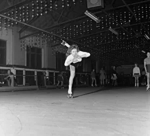 Sports Venue Prints: Teenager Betty Jones pictured roller skating at the rink in Birch Park