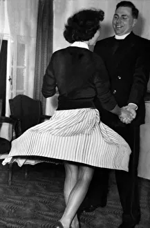 Nm20060428 Prints: Teenager Joyce Dearne enjoys a rock n roll dance with Rev. John Hornby