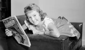 00007 Prints: Teenager Lesley Woods reading the Mirabelle magazine Girl Laying