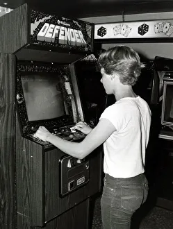 Teenager playing arcades - July 1983 14 year old Ian Pollard in Amusement Arcade in