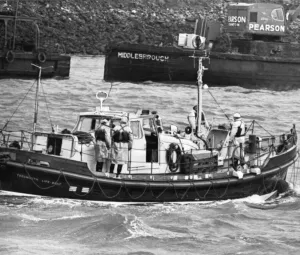 Rescue Prints: The Teesmouth lifeboat returning to harbour yesterday with the coxswain safe after he was