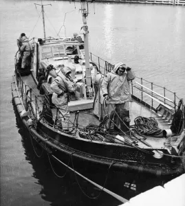 Accidents Prints: The Teesmouth lifeboat ties up at Middlesbrough dock after a Polish trawler rejected its