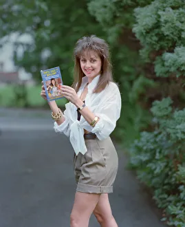 Author Prints: Television Presenter Carol Vorderman posing with her book Dirty