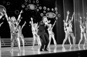 Girls Prints: Television presenter Des O Connor on the stage at the London Palladium during