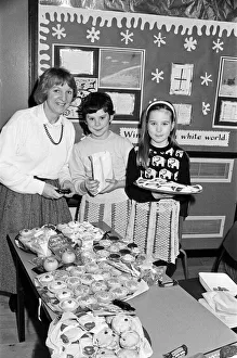 Ten-year-old Sarah Hanson (centre) serves customer Mrs Irena Wegrzyn at a bring