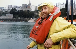 Crew Prints: Tenby lifeboat coxswain Alan Thomas at the Tenby lifeboat station before being presented