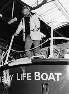 01504 Prints: Tenby lifeboat coxswain Alan Thomas at the Tenby lifeboat station before being presented
