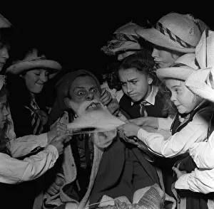 Terry Thomas 1957 as Father Christmas with girls from St Trinians Gap toothed