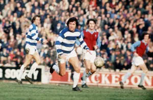 Terry Venables of Queen Park Rangers in action against Aston Villa at Loftus Road