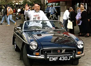 Negotiator Prints: Terry Waite former Middle East hostage sitting in his MG sportscar