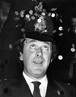 00112 Prints: Terry Wogan DJ & TV Presenter dressed up as a copper today to help raise the profile of