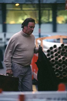 00125 Prints: Terry Wogan TV Presenter December 98 Outside BBC studio in london carrying jacket