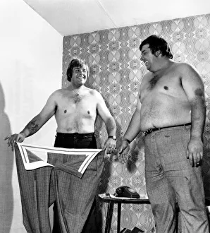 Terrys old suit, much too big now, still fits tubby brother Philip