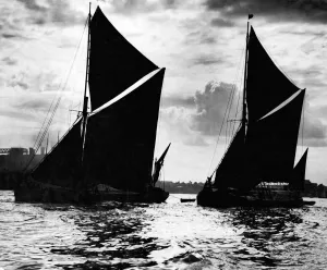 00094 Prints: Two Thames Barges leaving the London Docks with the high tide on a summers evening
